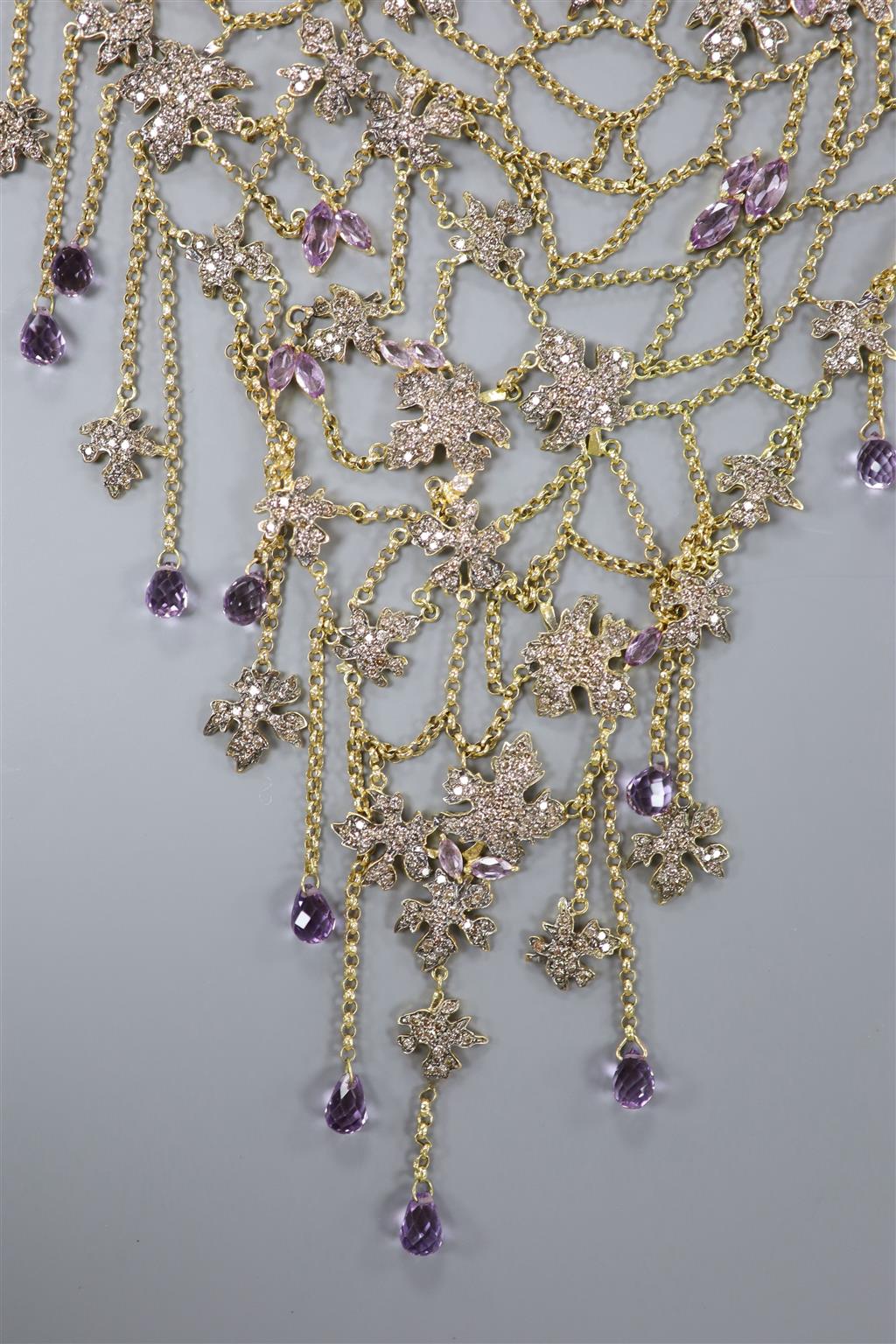 A 20th century yellow metal, amethyst and diamond chip set drop fringe necklace,